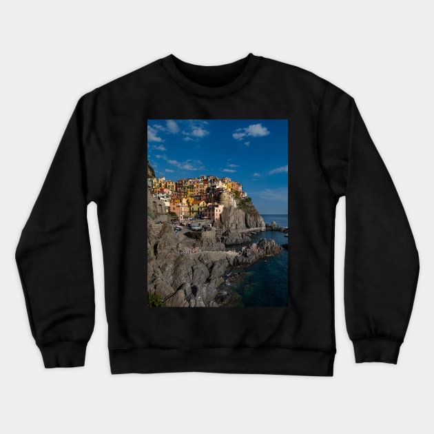 View on the cliff town of Manarola, one of the colorful Cinque Terre on the Italian west coast Crewneck Sweatshirt by Dolfilms